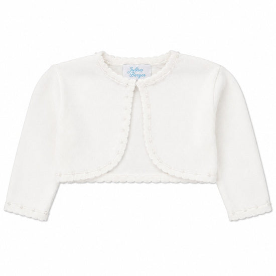 Carriage Boutique Julius Berger white baby girl bolero sweater with delicate scalloped edges and long sleeves.