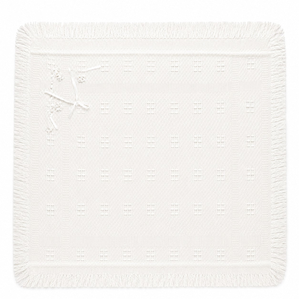 Carriage Boutique Julius Berger white baby christening blanket with delicate square pattern and fringe trim.