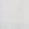 Carriage Boutique Julius Berger white knit baby blanket featuring a delicate textured cross pattern and fringe edge