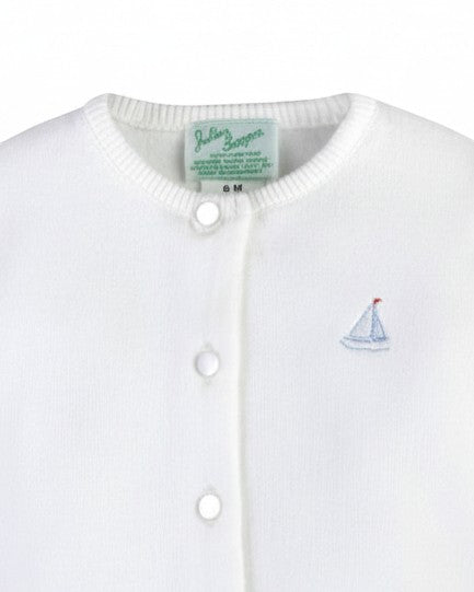 Carriage Boutique Julius Berger white cotton baby cardigan with a small embroidered sailboat motif and button front.