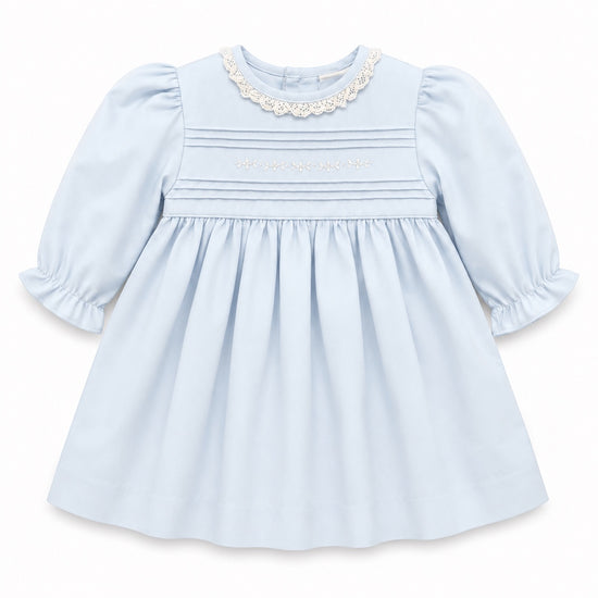 Carriage Boutique light blue cotton baby girl dress with lace collar, hand-embroidered pin-tucks, and puffy sleeves.