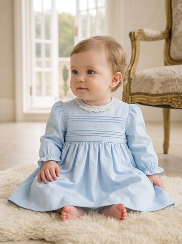 Carriage Boutique baby girl light blue cotton dress with long puffy sleeves, lace collar, and hand-embroidered detail