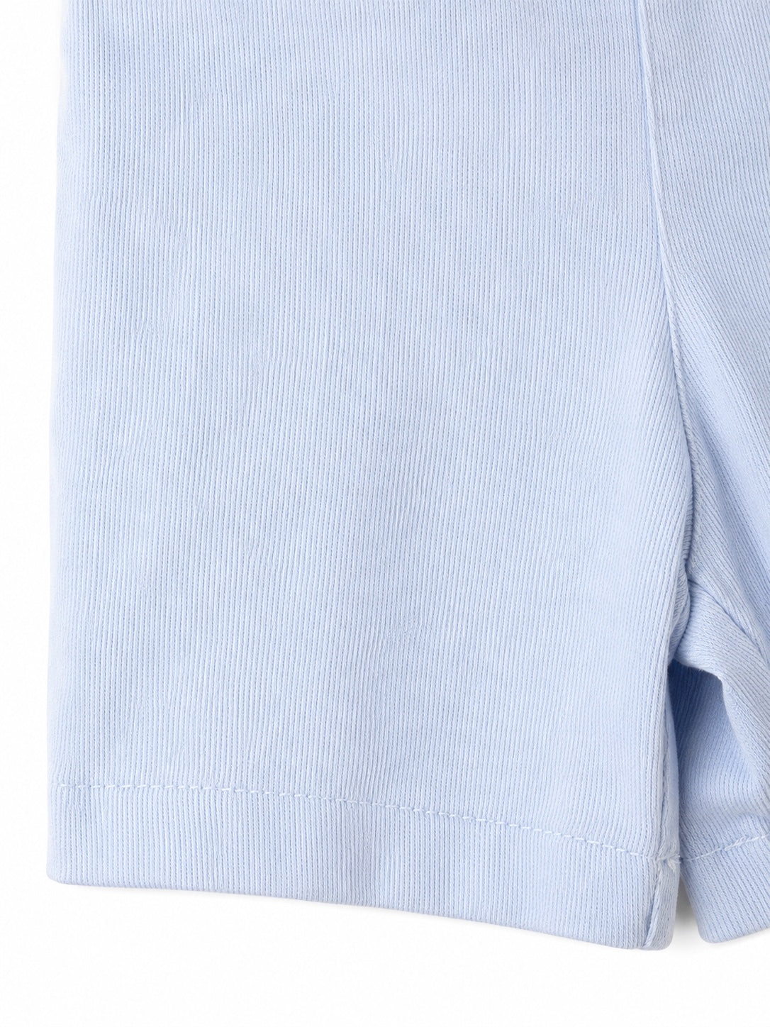 Close-up of the light blue cotton fabric texture on a Carriage Boutique Smocked Sailboats Bobby Suit.
