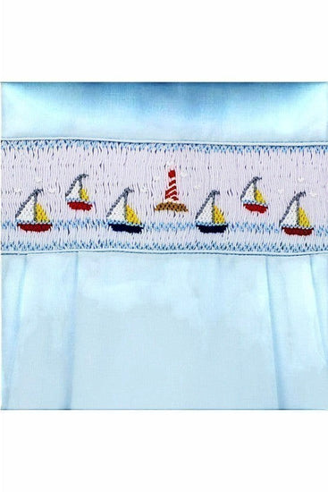 Carriage Boutique light blue cotton bubble romper with smocked chest featuring sailboats and a lighthouse embroidery.