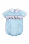 Carriage Boutique light blue cotton bubble romper with smocked chest featuring embroidered sailboats and lighthouse, white collar and cuffs.