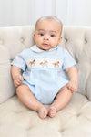 Carriage Boutique light blue smocked bubble romper with carousel horse embroidery and Peter Pan collar.