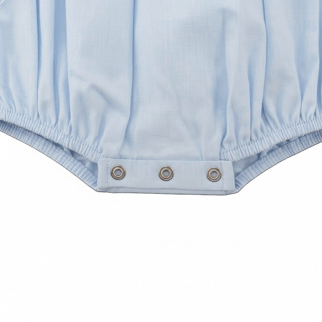 Carriage Boutique light blue smocked carousel horse bubble romper with Peter Pan collar and snap closure.