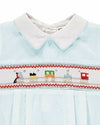 Carriage Boutique light blue baby romper with Peter Pan collar and smocked chest featuring a train motif in red, green, and yellow.