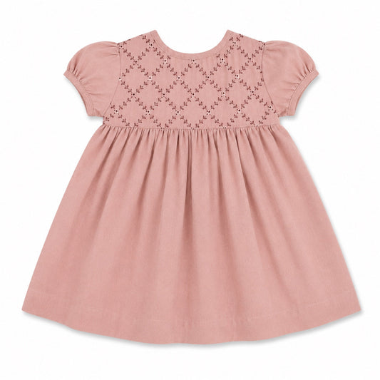 Carriage Boutique mauve baby dress with short sleeves, smocked yoke, and delicate floral embroidery on soft fabric.
