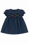 Carriage Boutique navy blue baby girl dress with smocked floral embroidery, puffy sleeves, and round neck.