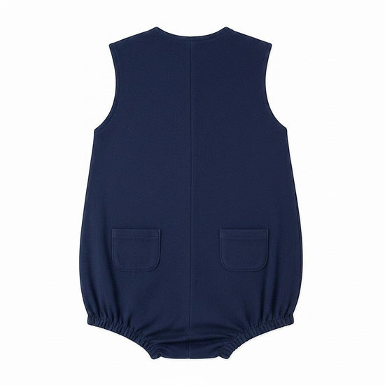 Carriage Boutique navy blue sleeveless bubble romper with sailboat embroidery and back pockets.