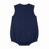 Carriage Boutique navy blue sleeveless bubble romper with sailboat embroidery and back pockets.