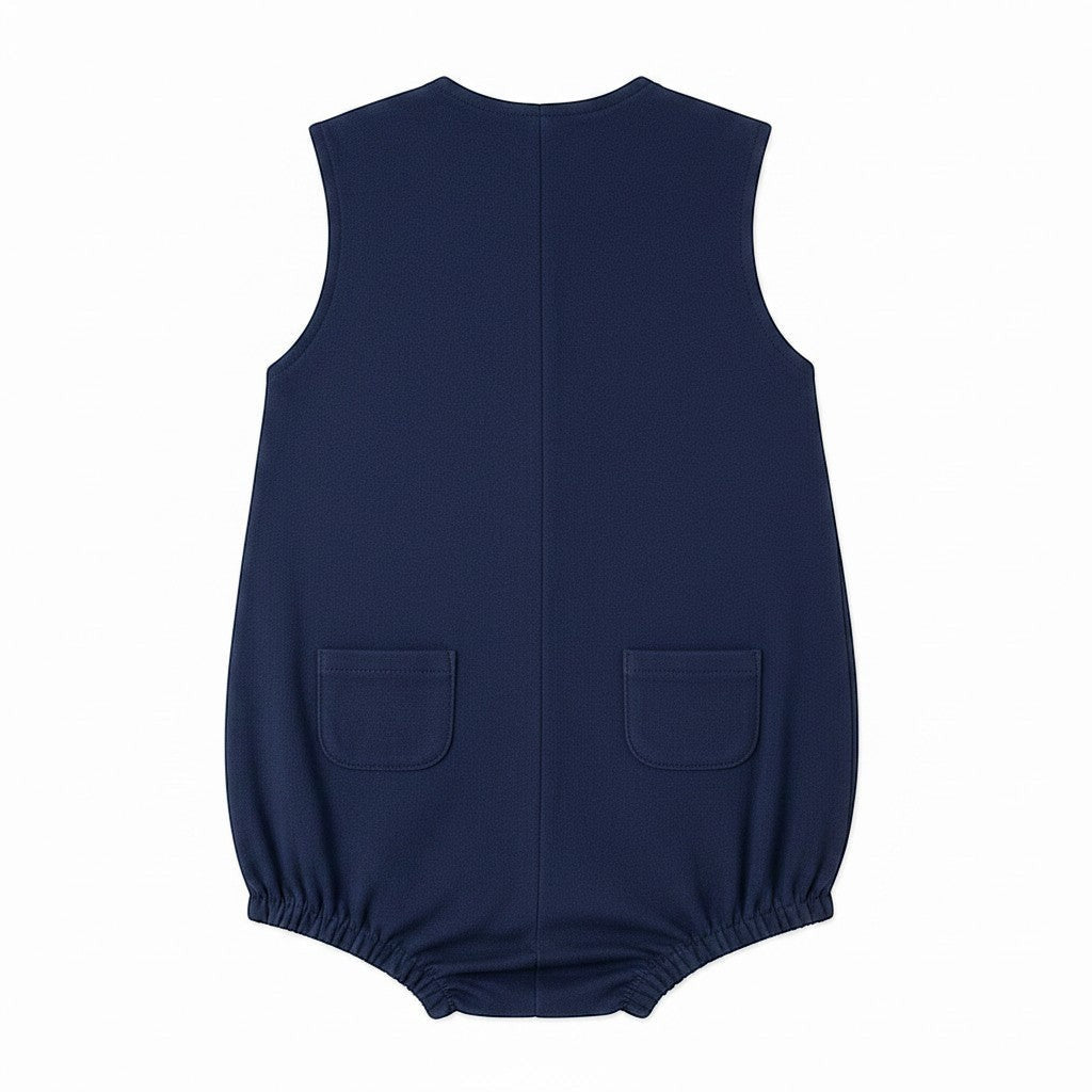 Carriage Boutique navy blue sleeveless bubble romper with sailboat embroidery and back pockets.