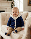 Carriage Boutique navy knit cotton baby jacket with cozy white sherpa lining, hood, and front button closure.