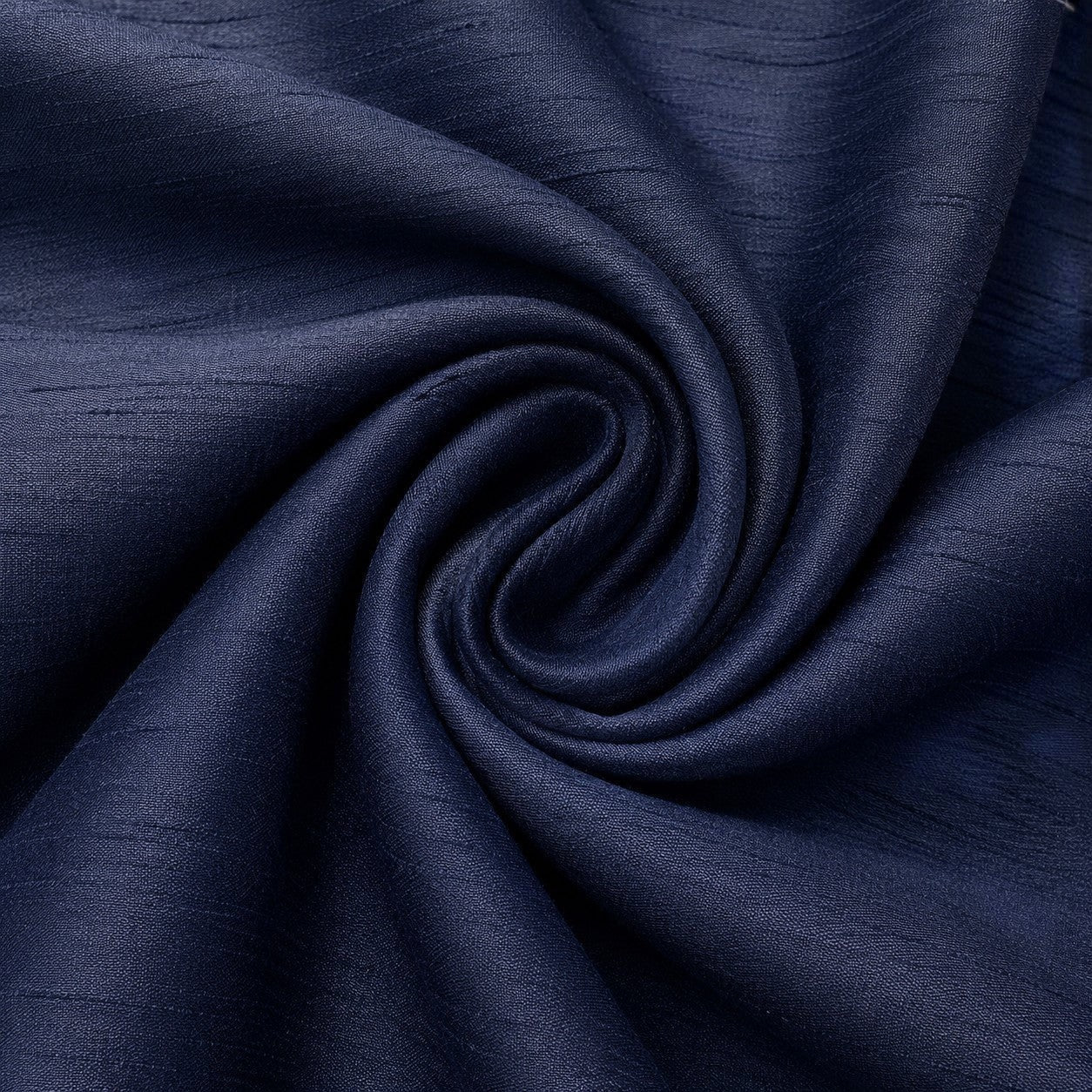 Close-up of navy blue poly silk fabric with a subtle textured weave from Carriage Boutique