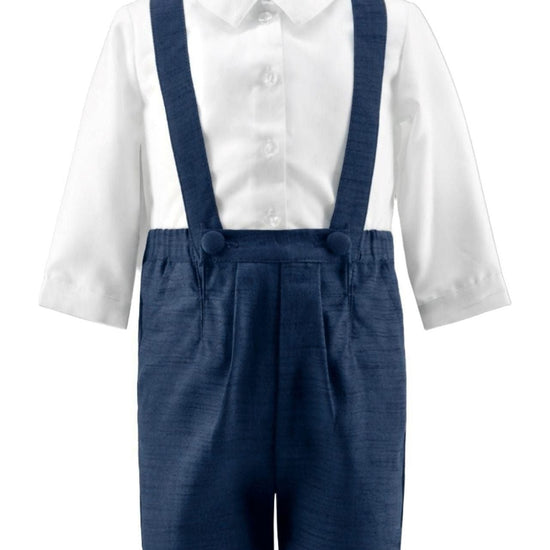 Carriage Boutique navy poly silk suspender shorts paired with a white long-sleeved collared shirt for baby boys.