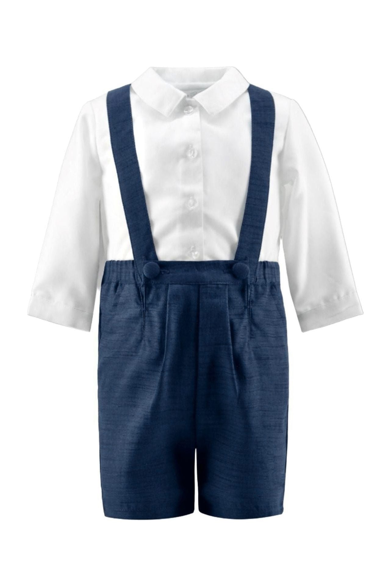Carriage Boutique navy poly silk suspender shorts paired with a white long-sleeved collared shirt for baby boys.