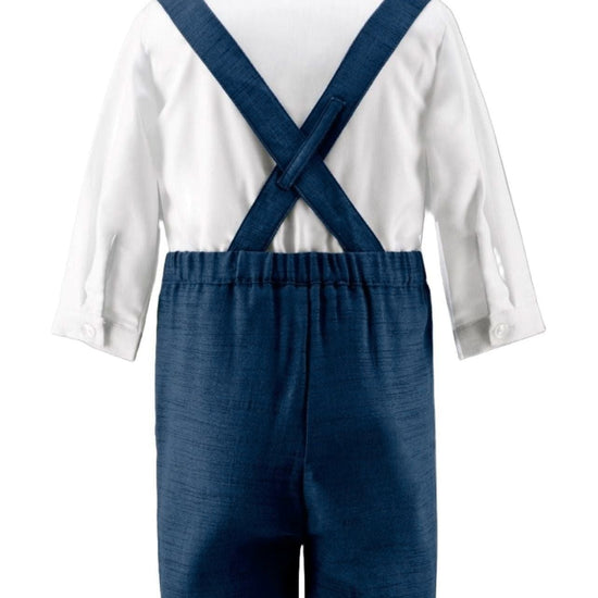 Carriage Boutique navy poly silk suspender shorts with a white long-sleeve shirt, back view of toddler formal outfit.