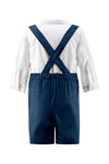 Carriage Boutique navy poly silk suspender shorts with a white long-sleeve shirt, back view of toddler formal outfit.