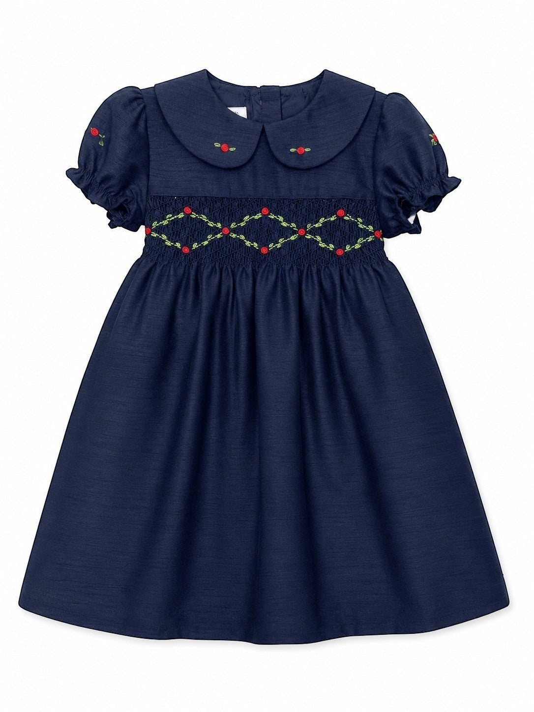 Carriage Boutique navy blue toddler party dress with smocked floral embroidery, puffy sleeves, and a round collar.