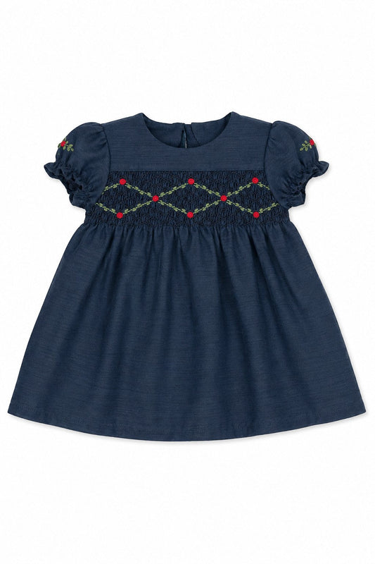 Carriage Boutique navy blue baby girl dress with smocked floral embroidery, puffy sleeves, and a round neck.
