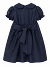 Carriage Boutique navy blue poly silk toddler party dress with a back bow, round collar, and floral sleeve detail.