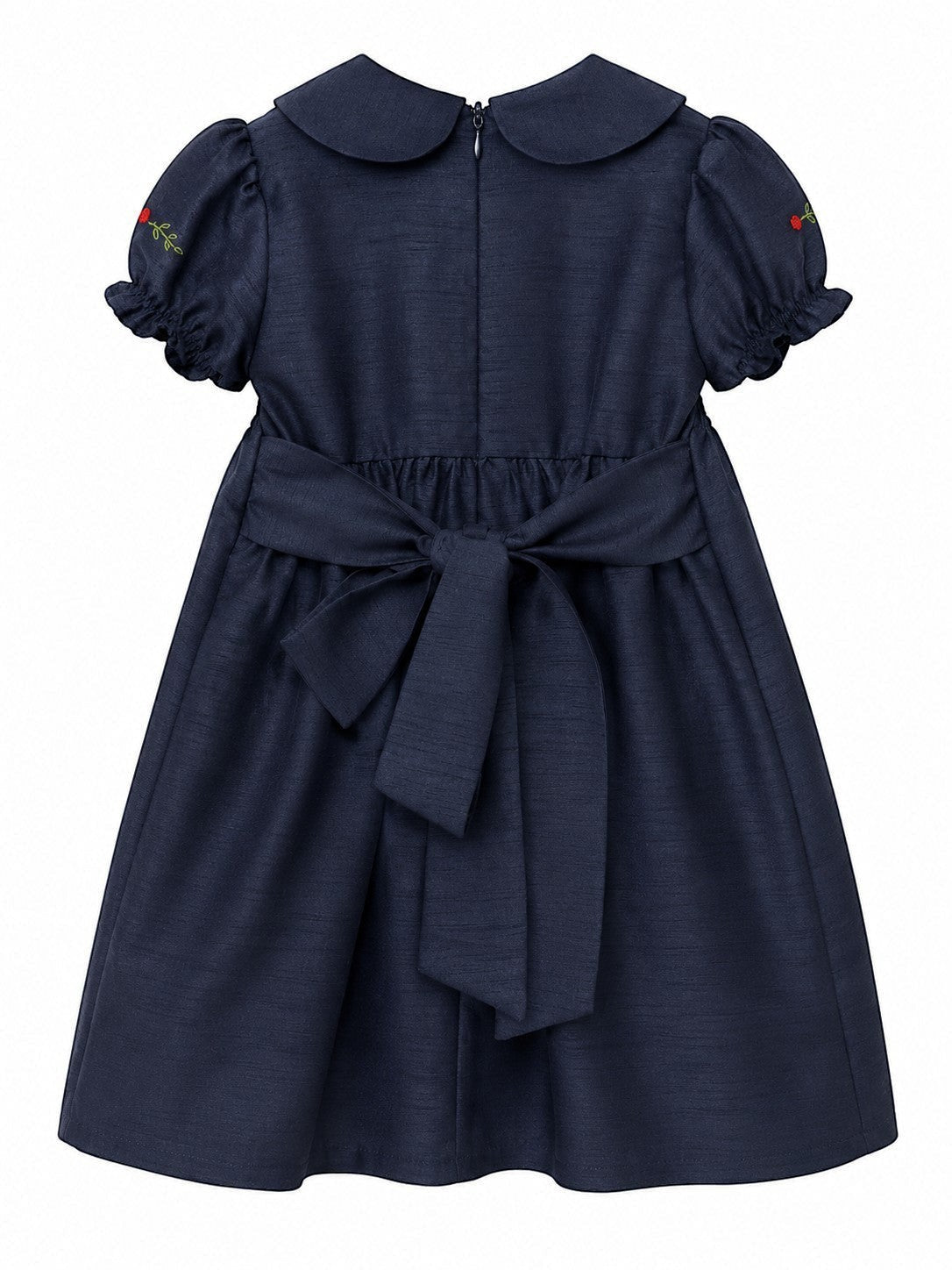 Carriage Boutique navy blue poly silk toddler party dress with a back bow, round collar, and floral sleeve detail.