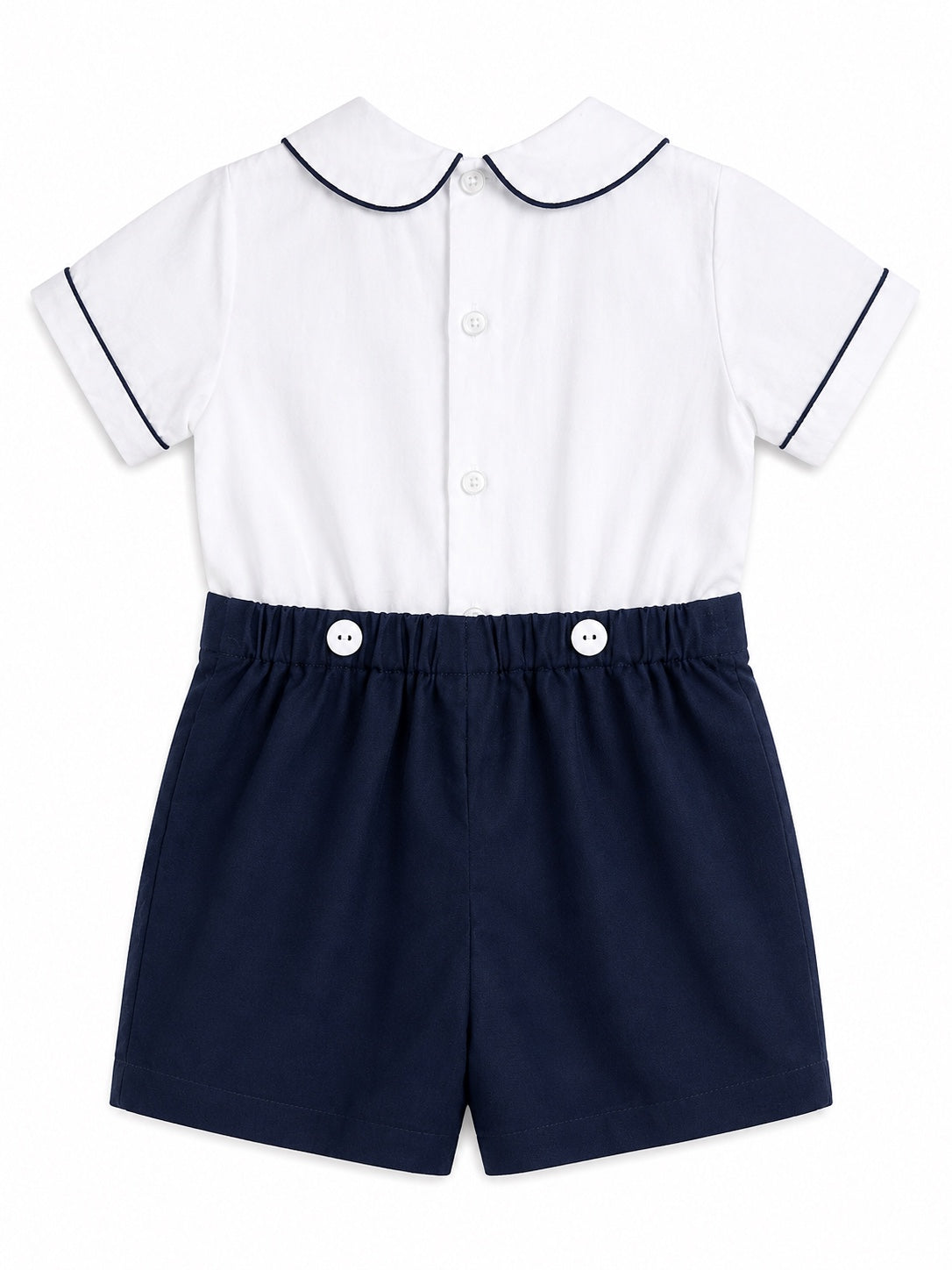 Carriage Boutique navy and white bobbie suit with Peter Pan collar, navy piping, and decorative buttons on shorts.