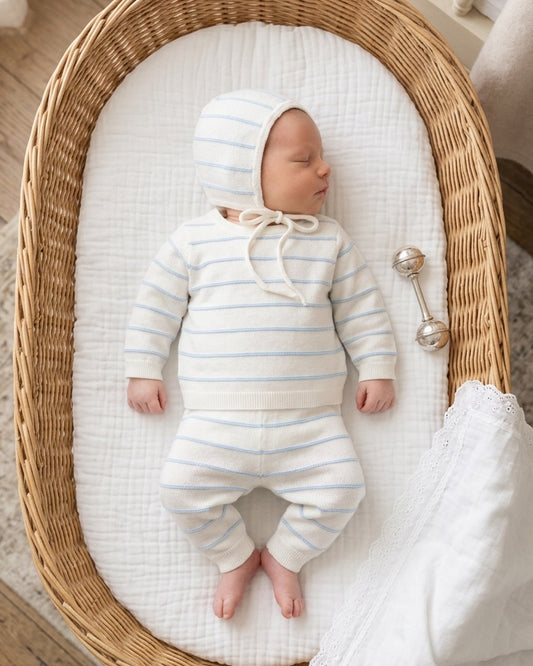 Carriage Boutique newborn 3-piece set in white with sky-blue stripes, featuring a long-sleeve top, leggings, and hat.