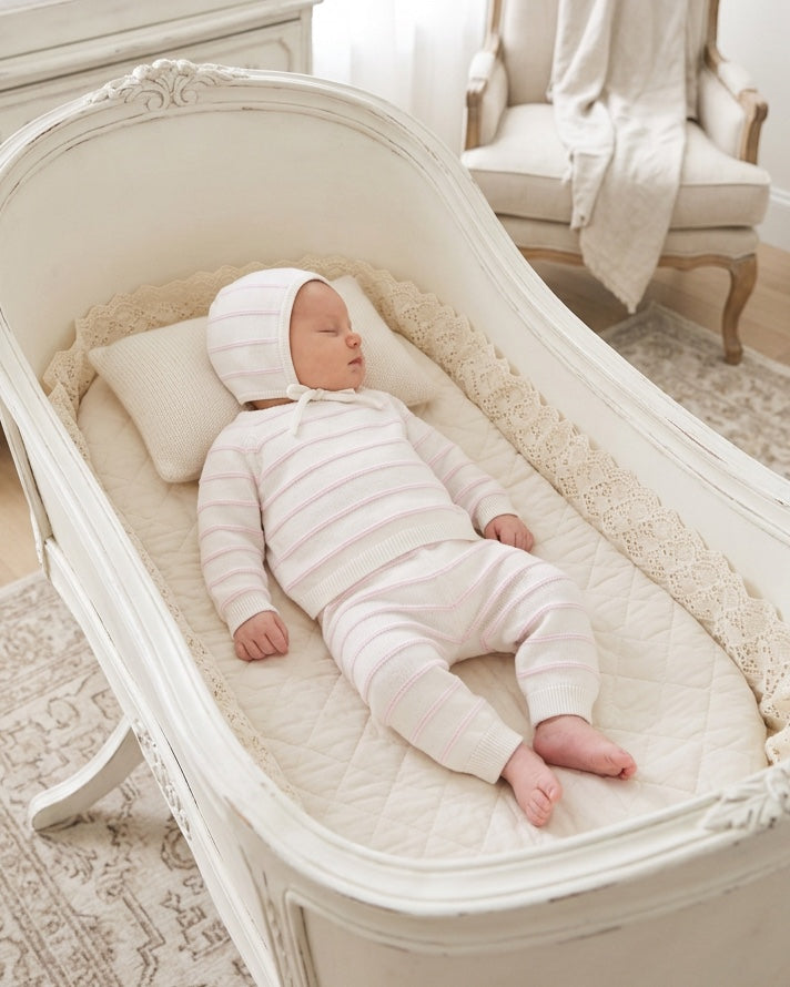 Carriage Boutique newborn 3-piece set with white and blush pink striped knit top, leggings, and matching baby bonnet.