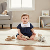 Carriage Boutique navy blue baby boy romper with bib featuring Noah's Ark embroidery and animals.