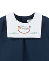 Carriage Boutique navy blue bubble romper with white Peter Pan collar embroidered with Noah's Ark and animals.