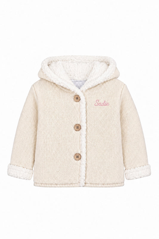 Carriage Boutique off-white knit cotton baby jacket with sherpa lining, hood, and three front buttons.