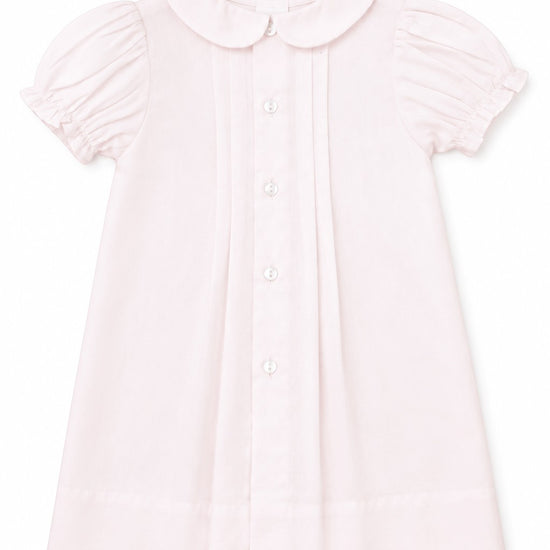 Carriage Boutique pale pink baby dress with Peter Pan collar, puff sleeves, and button-down front.