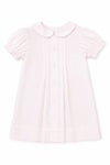 Carriage Boutique pale pink baby dress with Peter Pan collar, puff sleeves, and button-down front.