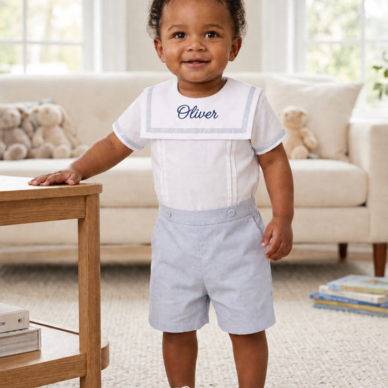 Carriage Boutique personalized gray bobby suit on a toddler with white sailor collar and embroidered name Oliver