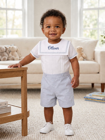 Carriage Boutique personalized gray bobby suit on a toddler with white sailor collar and embroidered name Oliver