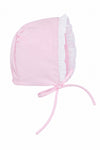 Carriage Boutique baby girl bonnet in soft pink fabric with white ruffled trim and tie closure for Easter.