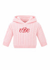 Carriage Boutique personalized pink cable knit baby sweater with a hood and red monogram embroidery on the chest