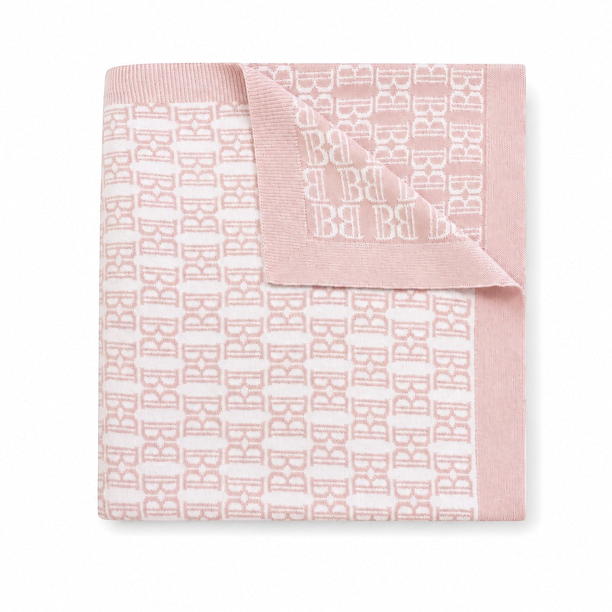 Carriage Boutique soft pink and white cotton baby blanket with a classic knit monogram pattern