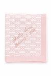 Carriage Boutique pink and white cotton baby blanket with custom embroidered name and date in a soft knit pattern.