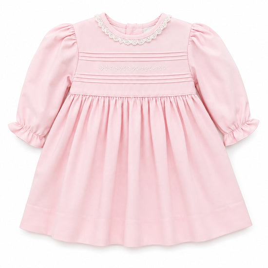 Carriage Boutique light pink cotton baby dress with long puffy sleeves, delicate lace collar, and hand embroidery.