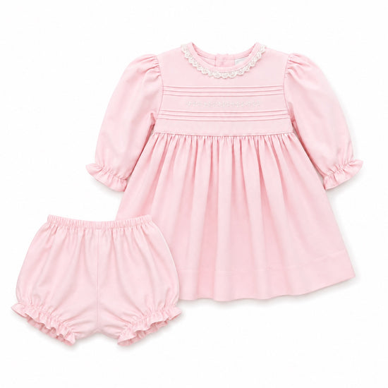 Carriage Boutique light pink cotton baby dress with lace collar, hand embroidery, and matching ruffled bloomers.