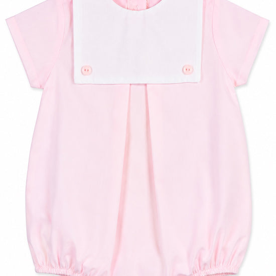 Carriage Boutique baby girl bubble romper in light pink cotton with a white button bib and short sleeves.