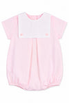 Carriage Boutique baby girl bubble romper in light pink cotton with a white button bib and short sleeves.