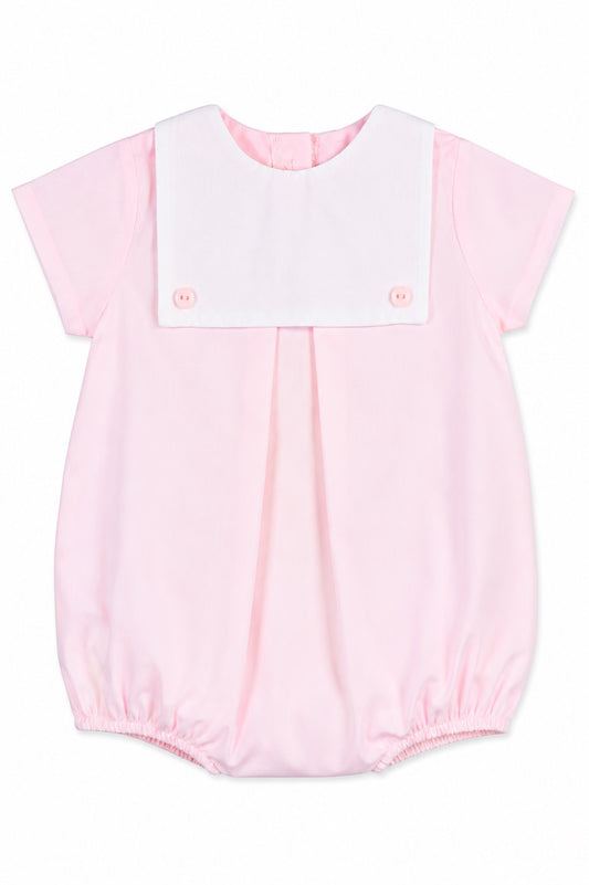Carriage Boutique baby girl bubble romper in light pink cotton with a white button bib and short sleeves.