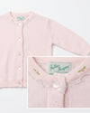 Carriage Boutique pink cotton cardigan for girls featuring delicate embroidered rosebuds and a lace-trimmed crew neck.