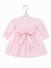 Carriage Boutique light pink cotton baby dress with long puffy sleeves, lace collar, and back bow sash
