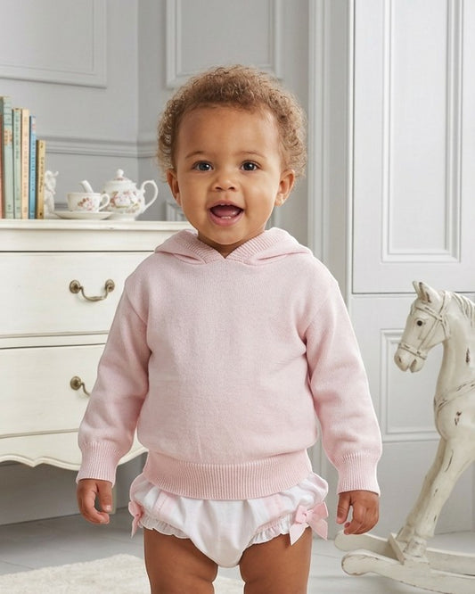 Carriage Boutique baby girl wearing a soft pastel pink cotton knit hooded sweater with ribbed trim.