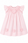 Carriage Boutique classic pink baby girl dress featuring delicate smocking, flutter sleeves, and 3D floral cut outs.